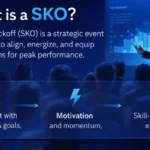 Sales Kickoff (SKO) presentation in a corporate conference setting with blue lighting and performance chart on screen