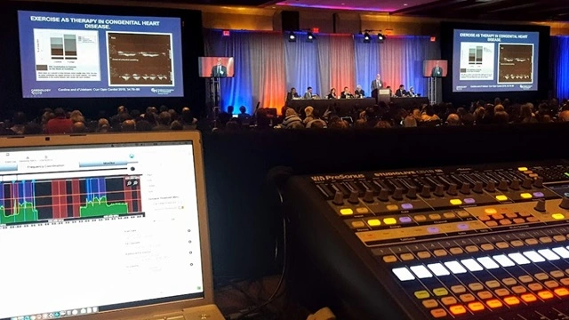 A large-scale executive conference ballroom with 1,200 attendees viewing synchronized LED repeater screens. This illustrates Eleven Eleven AV’s SDI-over-IP signal distribution, ensuring furniture-grade clarity and 100% visual parity across a deep venue layout.