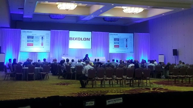 A custom textured scenic tower with integrated LED branding used in an enterprise event set design case study, demonstrating modular assembly for zero-downtime session transitions.