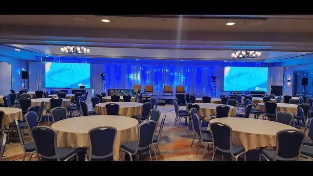 Corporate conference stage lighting in San Diego featuring keynote presentation screens, professional stage illumination, and an enterprise event venue prepared for executive sessions.